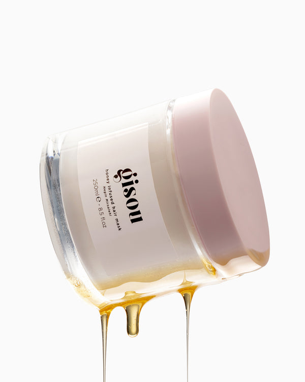 Honey Infused Hair Mask with oil dripping on the side
