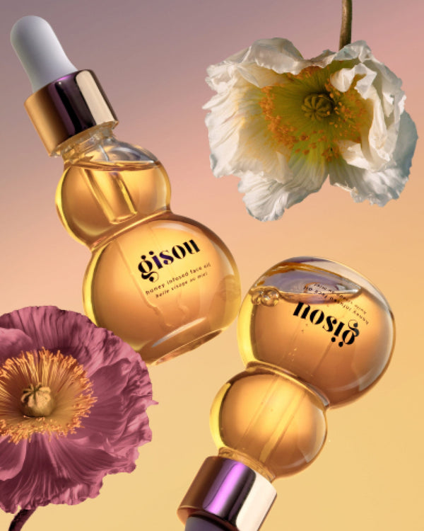 Honey Infused Face Oil bottles with spring flowers